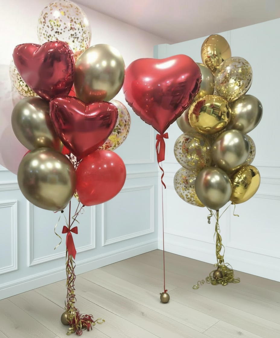 Gran corazón rojo con dos fuentes de globos