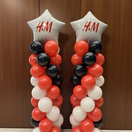 2 columnas de globos con 2 estrellas gigantes